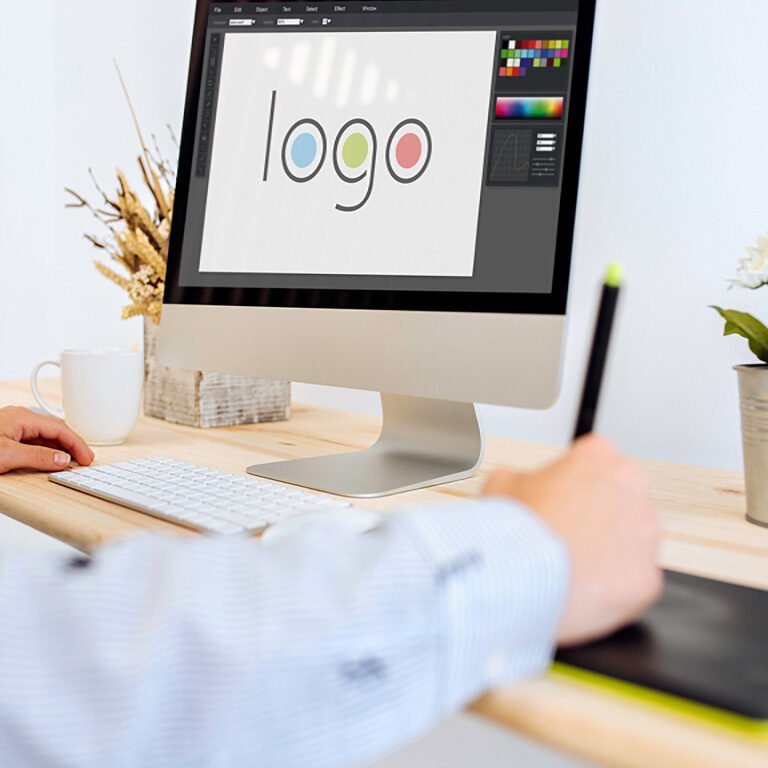 designer designing a logo with a computer